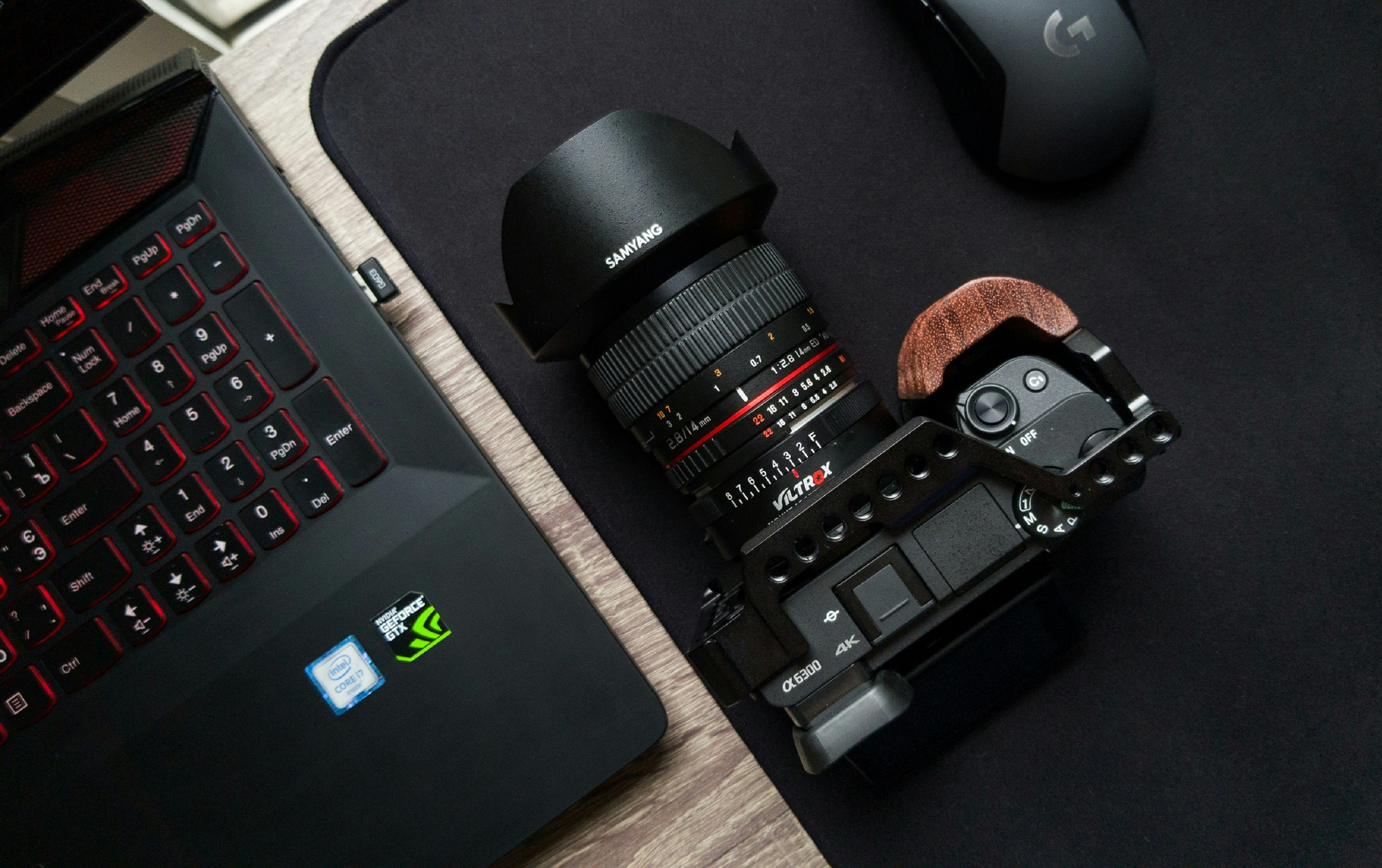 black camera lens on black laptop computer